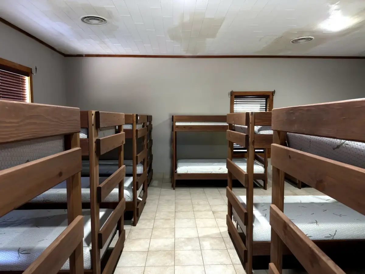 Bunk room with multiple bunk beds in the Bunk House
