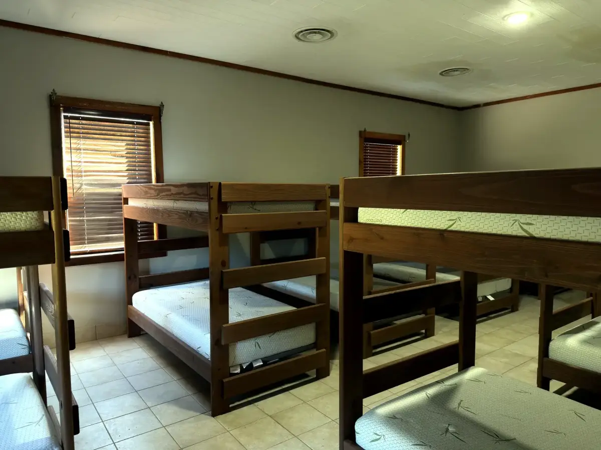 Large bunk room sleeping many guests in the Bunk House
