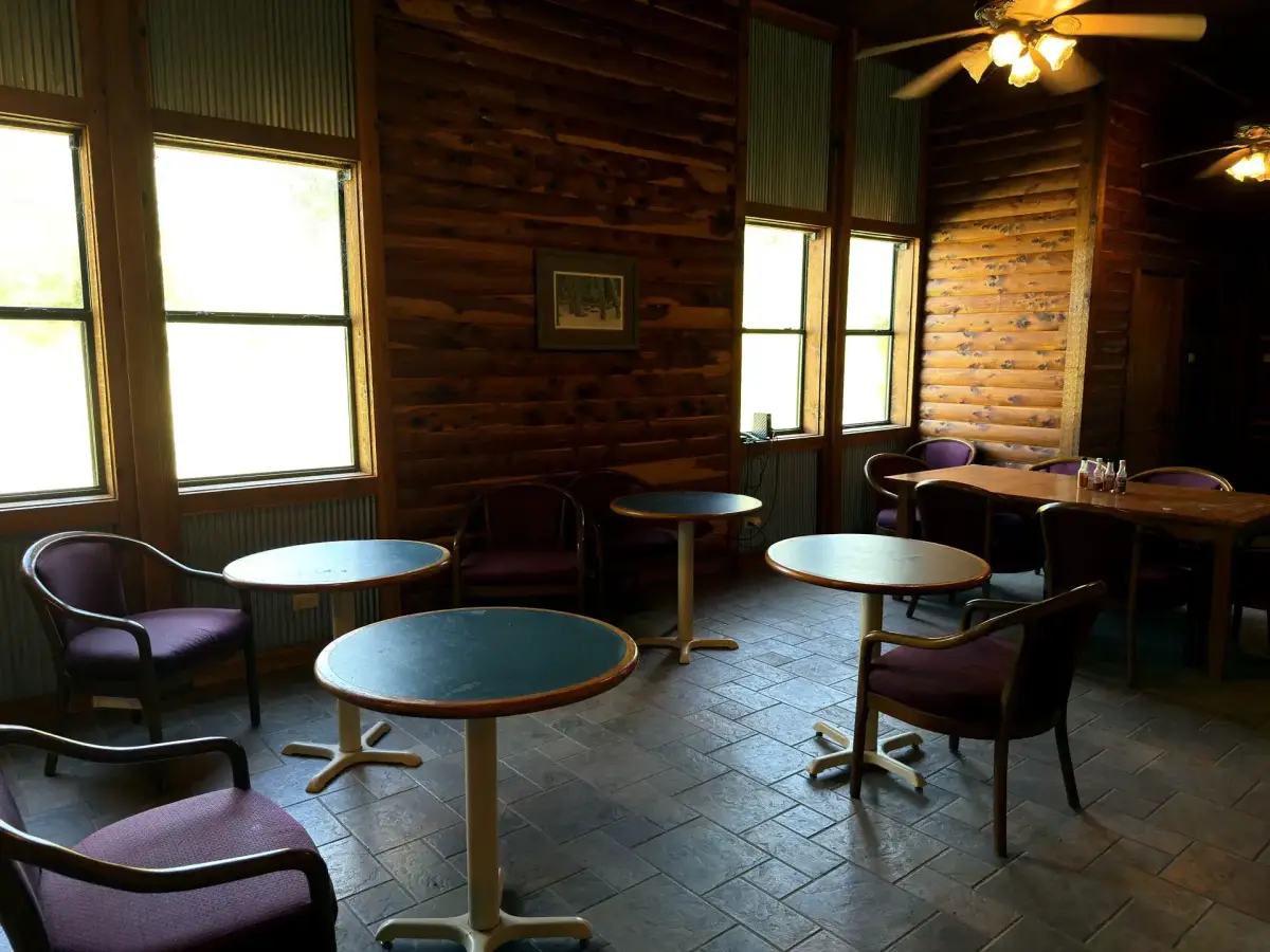 Dining and common area with tables in the Bunk House