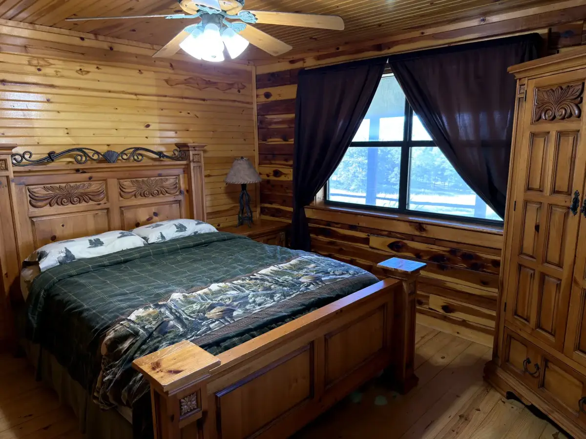 Master bedroom with king bed in the Cabela Cabin