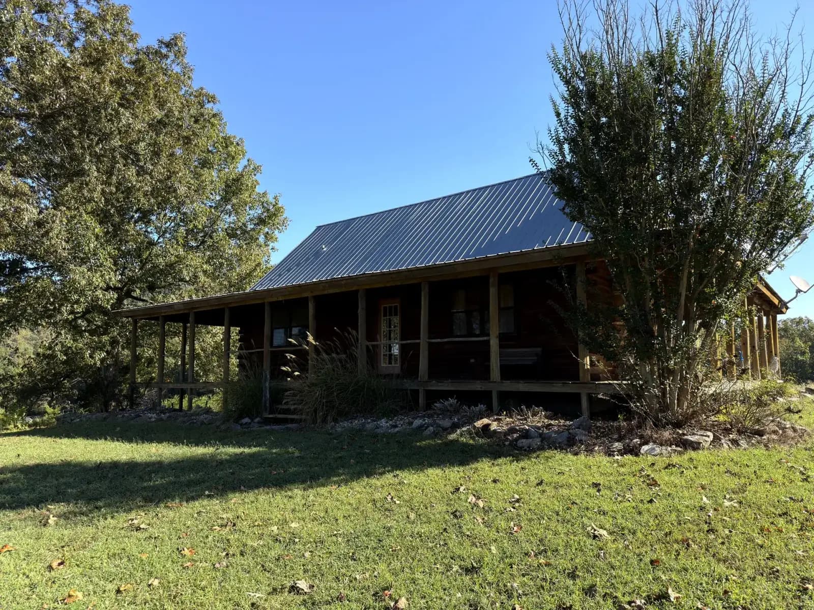 The Cabela Cabin with covered porch at Sanctuary Ranch in the Arkansas Ozarks