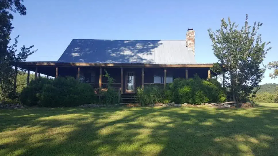 Rustic hunting cabin at The Sanctuary Ranch in Arkansas, perfect for solo hunters or small groups